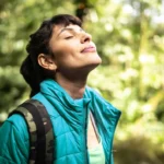 female-eyes-closed-in-woods-1296-728-header