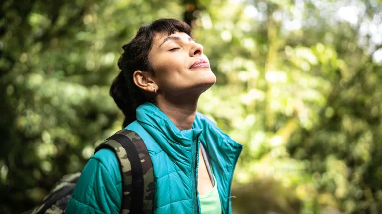 female-eyes-closed-in-woods-1296-728-header